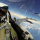 Illustration for article titled Extremely rare photo of two armed F-16s escorting a Boeing Dreamliner